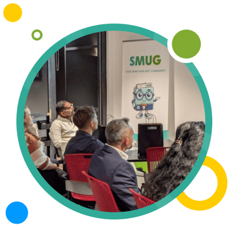 Attendees at a past SMUG event listen to a presentation as UKG customers and workforce management professionals come together to share insights.